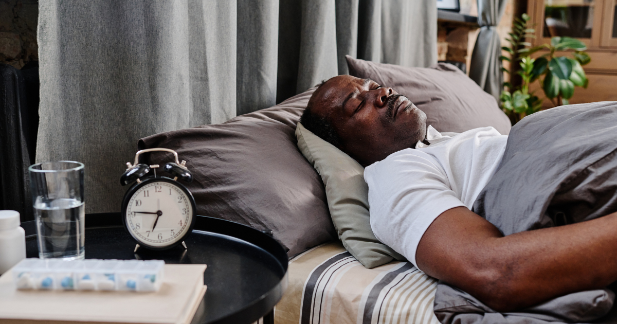 man sleeping in bed